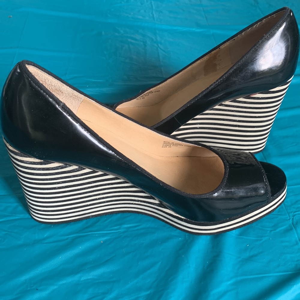 Gently worn Michael Kors Adlai’s Black and Cream Strip Wedge Shoes.
